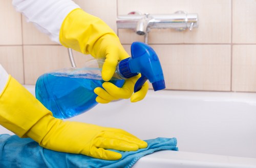 Eco-friendly office cleaning supplies on a desk